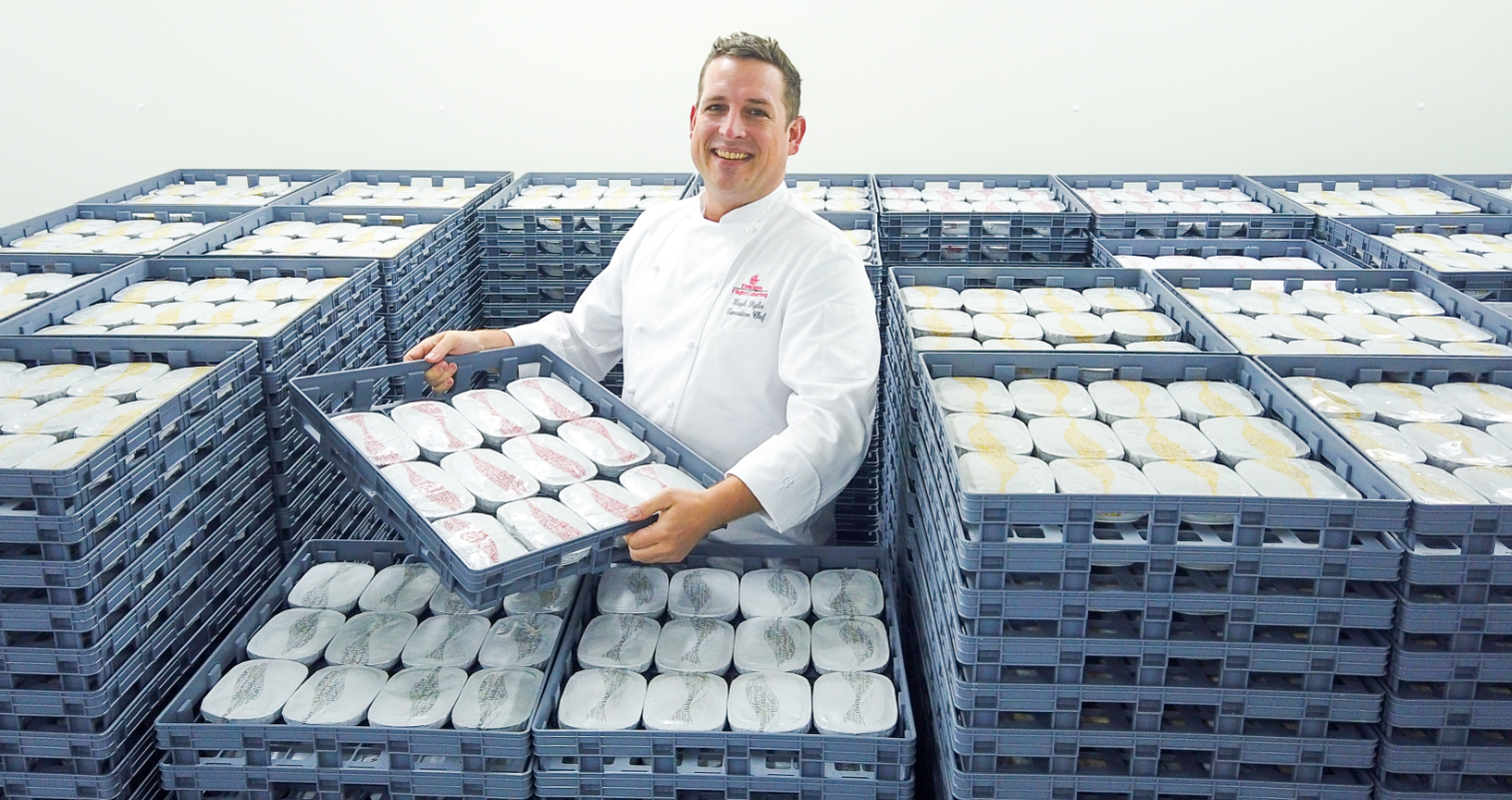 Executive Chef Hugh Styles showcasing EKFC's new reusable crates 